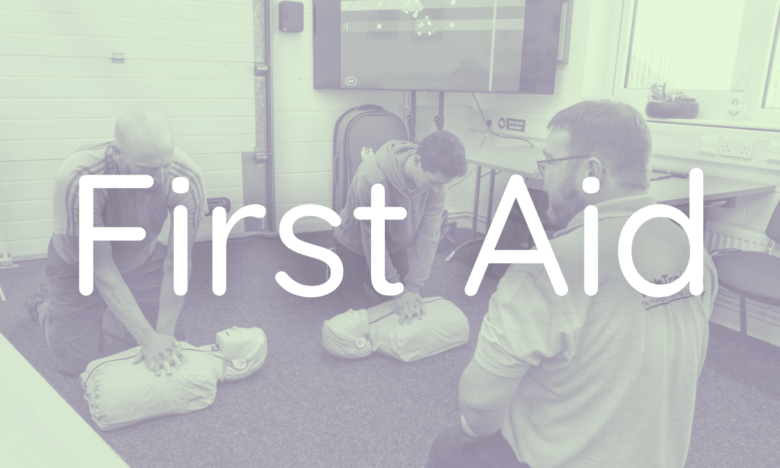 2 People having a digital CPR race under the instruction of a FABTraining Instructor. 